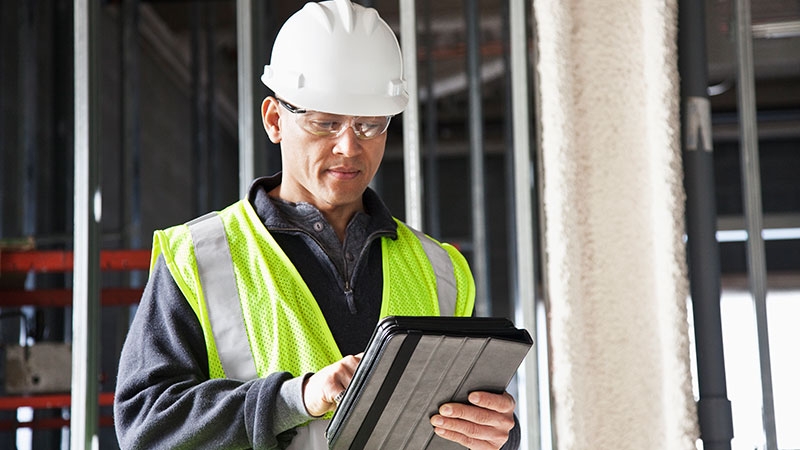Grid technician analyzing substation security from cyber threats