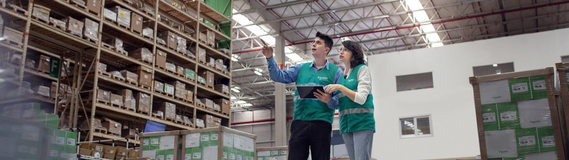 Two people communicating in the factory building