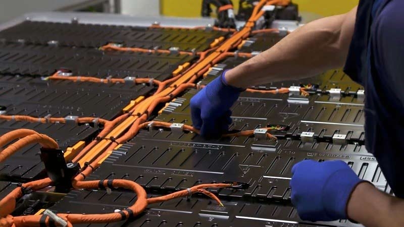 A person is connecting a circuit